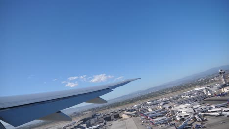 Plane-taking-off-from-airport,-View-through-an-airplane-window