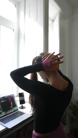 woman doing a neck massage during online workout