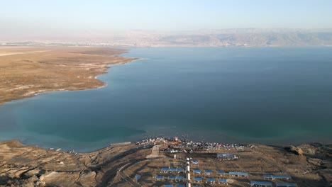 Aerial-shot-of-stormy-land-in-summer,-drone-flying-over-landscape---Dead-Sea,-Israel