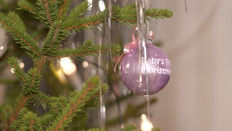 close-up of shiny decoration ball in christmas tree, close shot