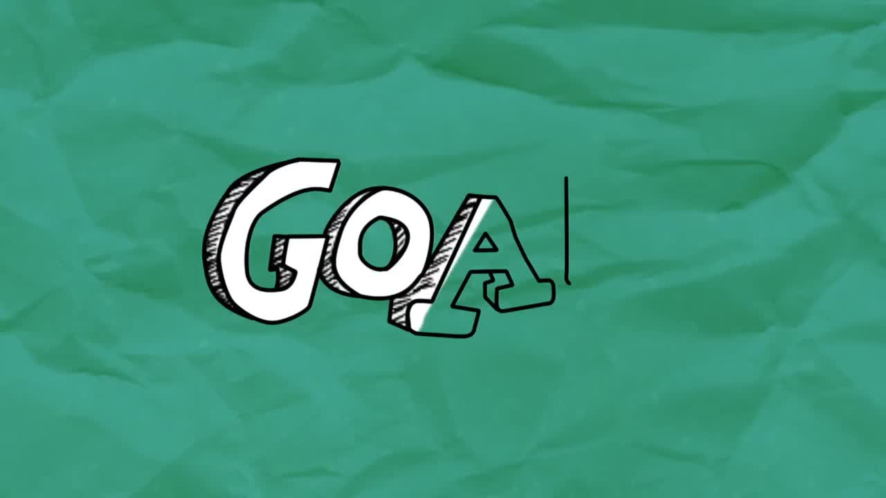 Goal text against green crumpled paper in background