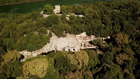 Drone-view-of-Butrint-Archeological-site,-Albania,-Europe-panning-shot-of-theatre