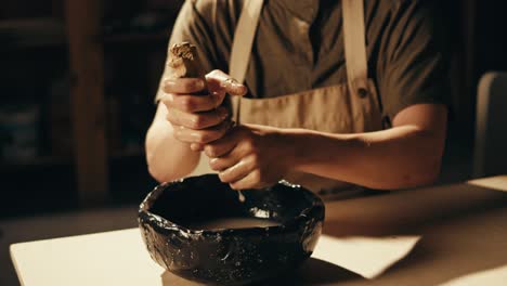 pottery artist kneading clay