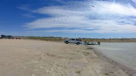 man preparing his fishing boat for launch into lake falcon near roma texas in the rio grande valley