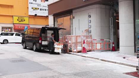 workers unloading goods from a van