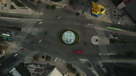 Aerial-Hyperlapse,-Roundabout-Traffic-in-Mexico-City-at-Morning,-Avenue-Intersection-and-Vehicles,-Top-Down-Descending-Drone-Shot