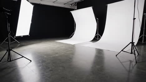 empty photography studio with white backdrops