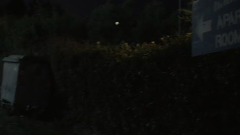 pointer showing the way to apartments for rent at night