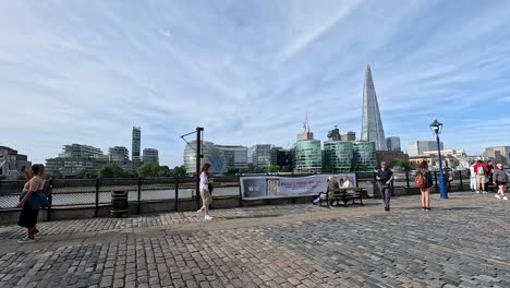 tourists walking near tower bridge, london