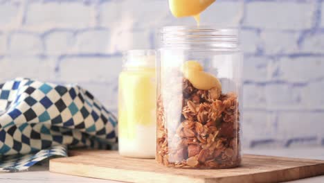 making a delicious granola parfait with yogurt and lemon