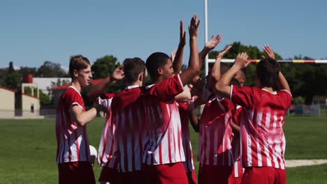 rugby players celebrating on the field