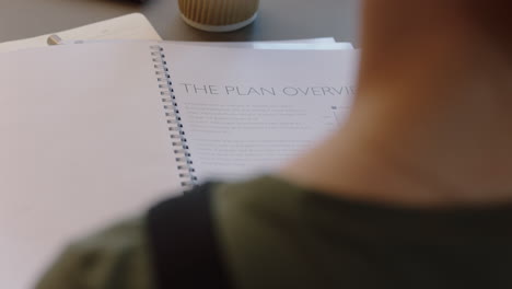 business woman hands browsing corporate documents looking at project proposal in boardroom meeting close up