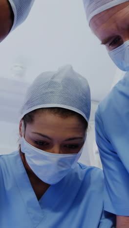 surgery team operating a patient in an operating room