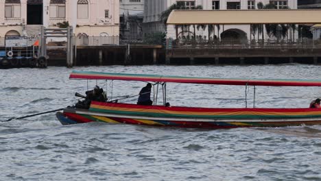 a boat travels along a city river