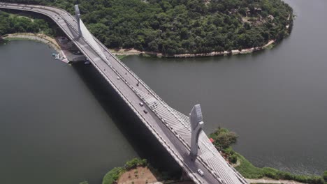 Drone-footage-of-the-Durgam-Cheruvu-Cable-Bridge-on-the-Durgam-Cheruvu-Lake-connecting-Jubilee-Hills-and-the-Financial-District-of-New-Hyderabad-City,-India