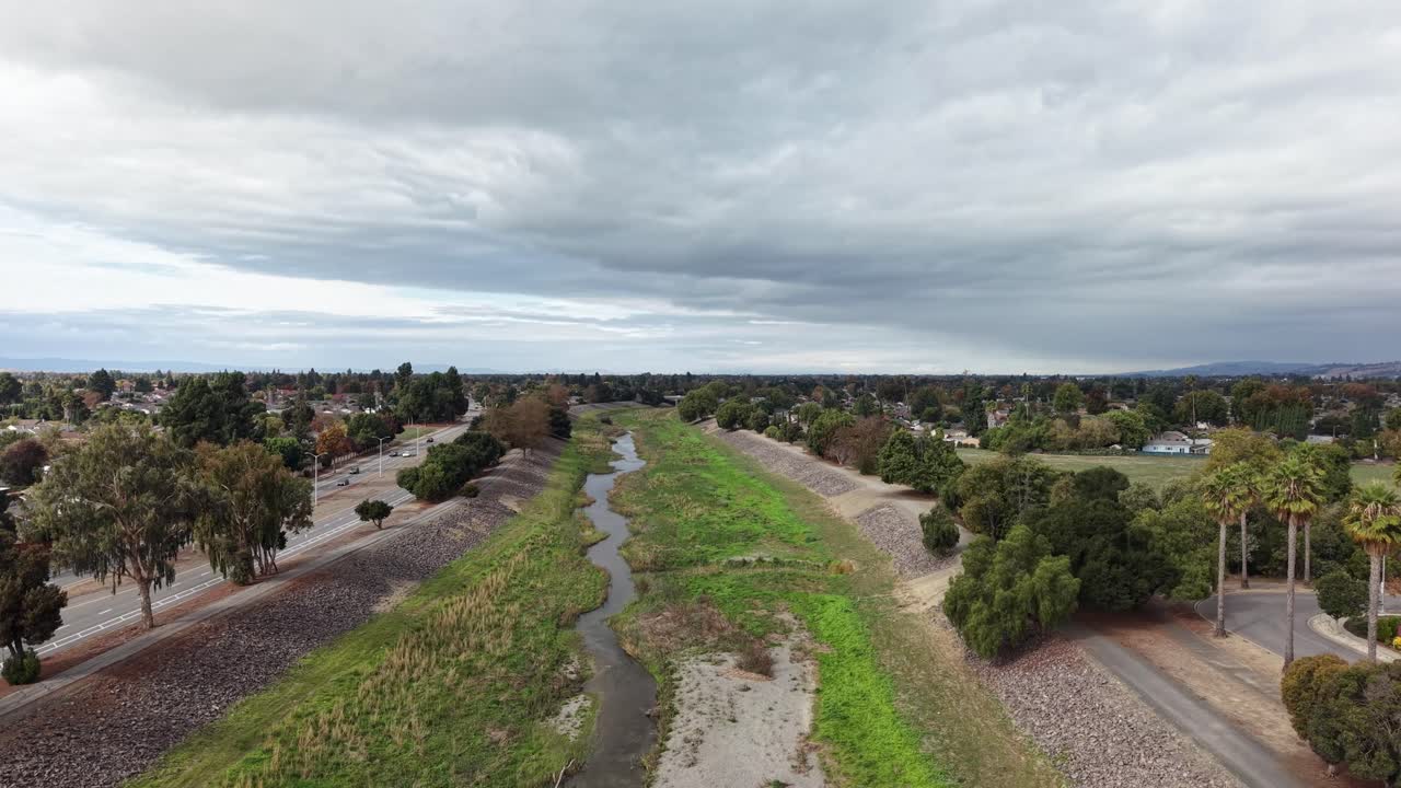 Aerial views reveal Alameda Creek Trail winding through Fremont’s quiet neighborhoods, where tree-lined streets and gentle waterways create a blend of suburban life and natural space