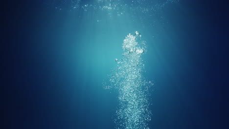 underwater sunlight beams shining from above coming through the deep crystal clear blue water causing a beautiful water lighting reflections curtain with air bubbles rising up to the surface