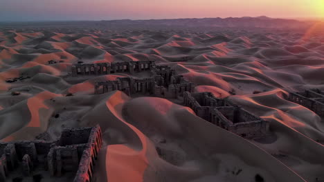 abandoned ruins in the desert at sunrise