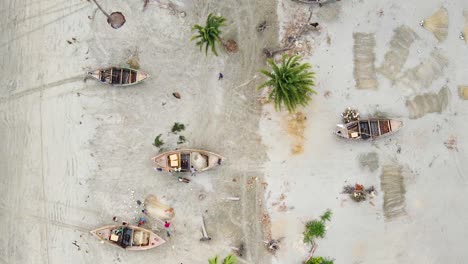 fishing boats and fishers preparing their nets at the kuakata sea shore in bangladesh, fishing village, asia, drone