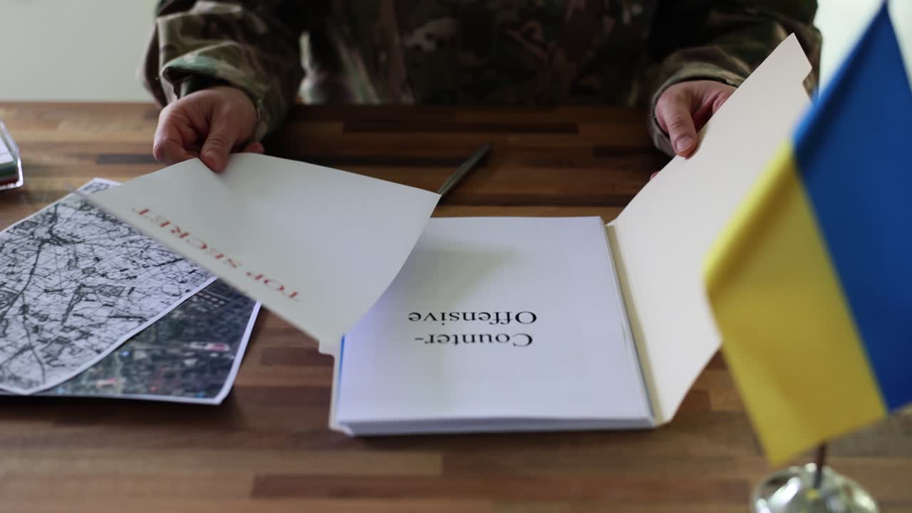 Military planning with top secret documents and a map of Ukraine