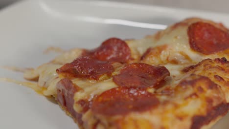 a close up of a plate of pizza slices captures the essence of comfort food, with each slice oozing with cheese and toppings