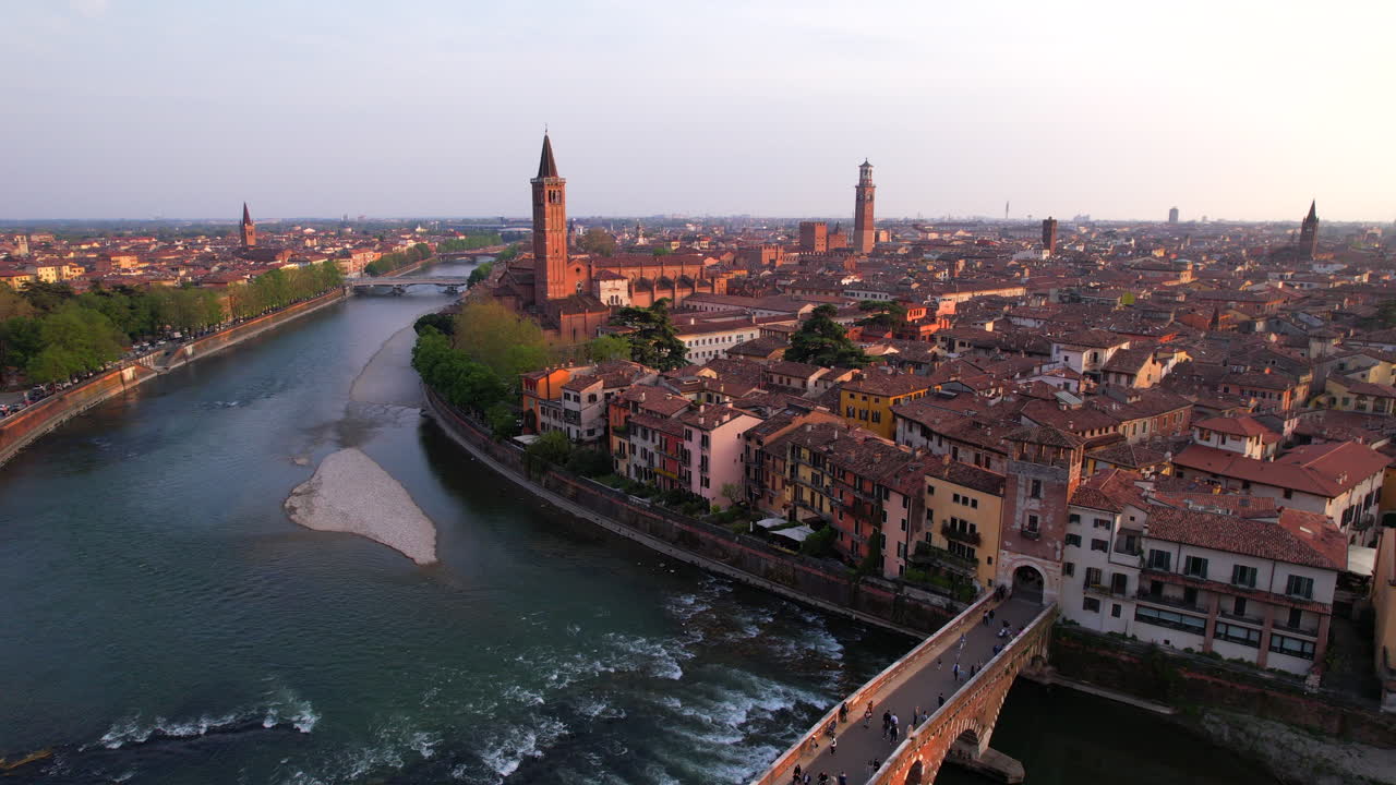 Verona italian city and Adigio river at sunset. Aerial ascent