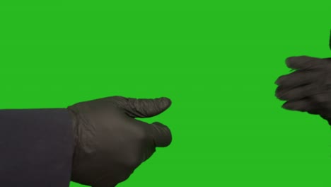 transaction, the transfer of money stack and shaking hands with rubber gloves