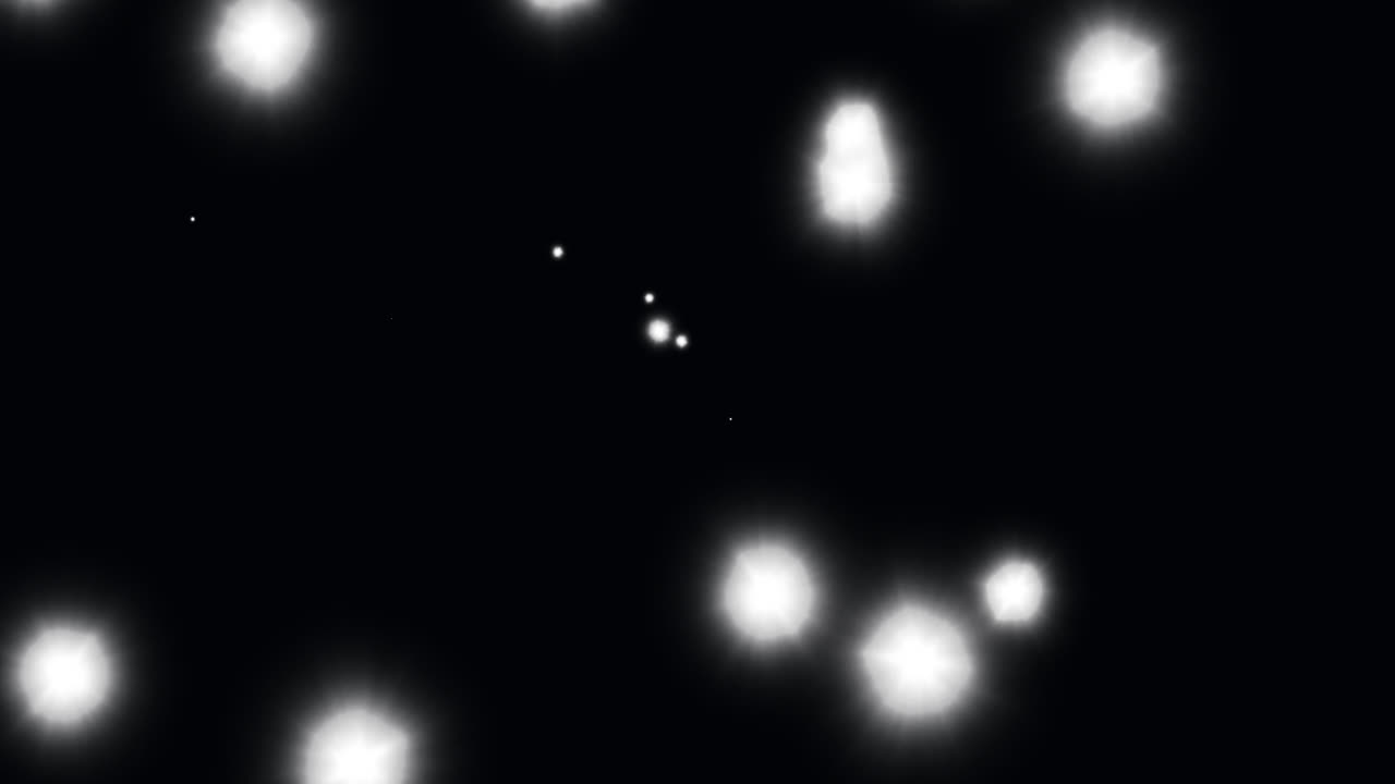 Animation of glowing white spots of light moving in hypnotic motion on black background