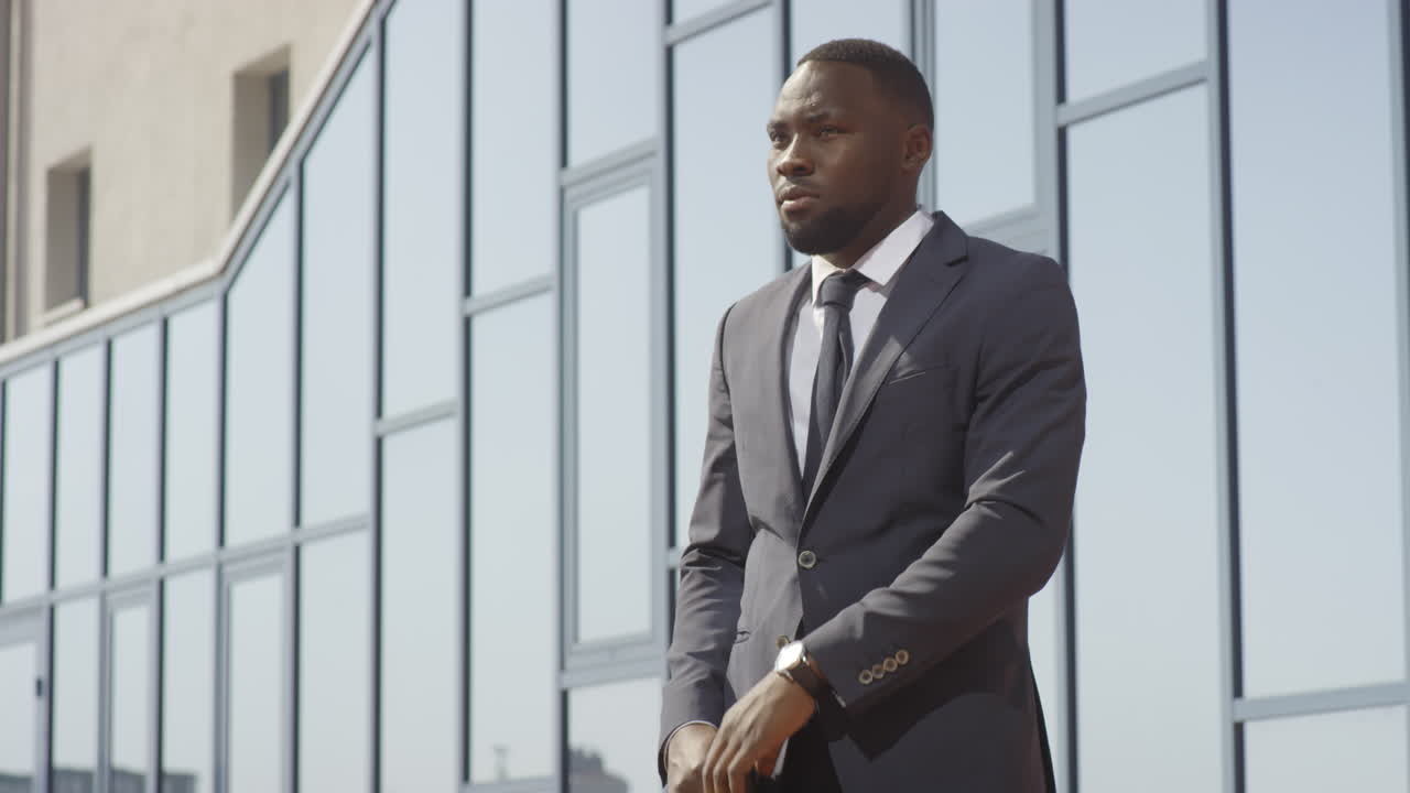 African American Businessman Catching Cab Near Office