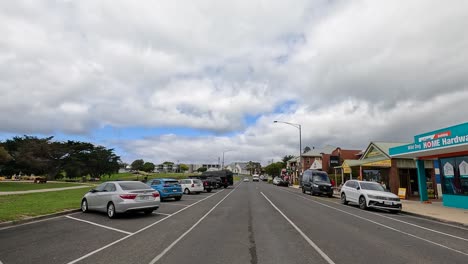 a 55-second drive through a coastal town on great ocean road, showcasing vibrant streets and overcast skies