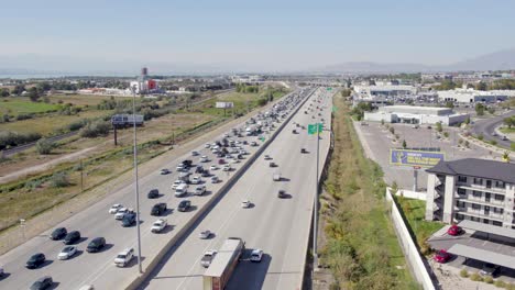 aerial view of multi-lane highway interstate in utah, vehicles slowly moving in traffic