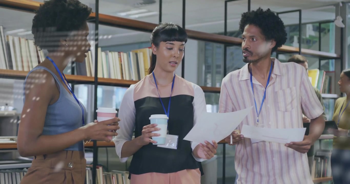 Diverse Team Collaborating on Project in Modern Office