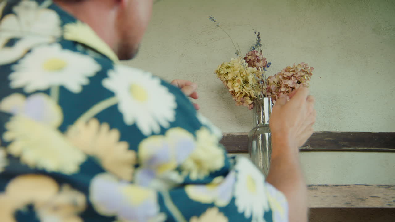 Placing Dried Flowers on a Shelf