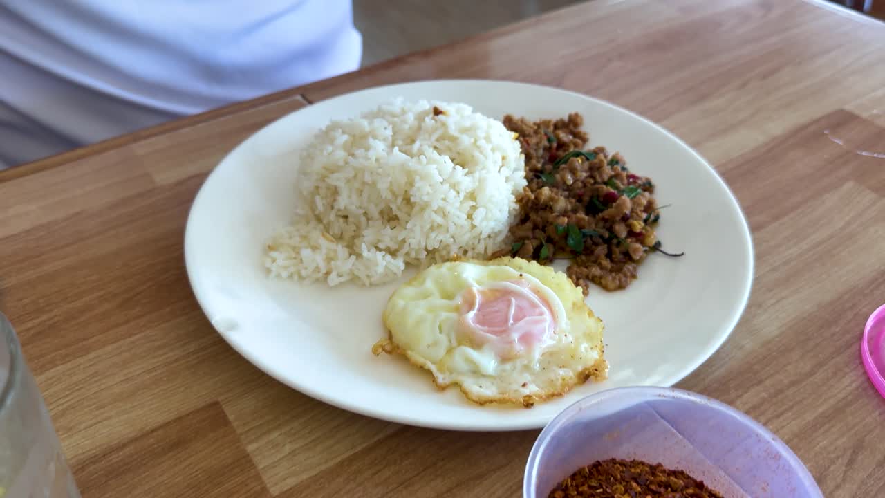 Thai Food with Rice, Pork, Egg, and Chili