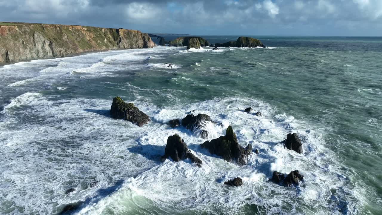 Epic Ireland rough seas and waves breaking on reef winter storm Copper Coast Waterford