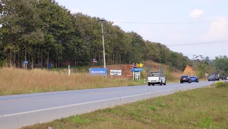 vehicles moving along a rural highway