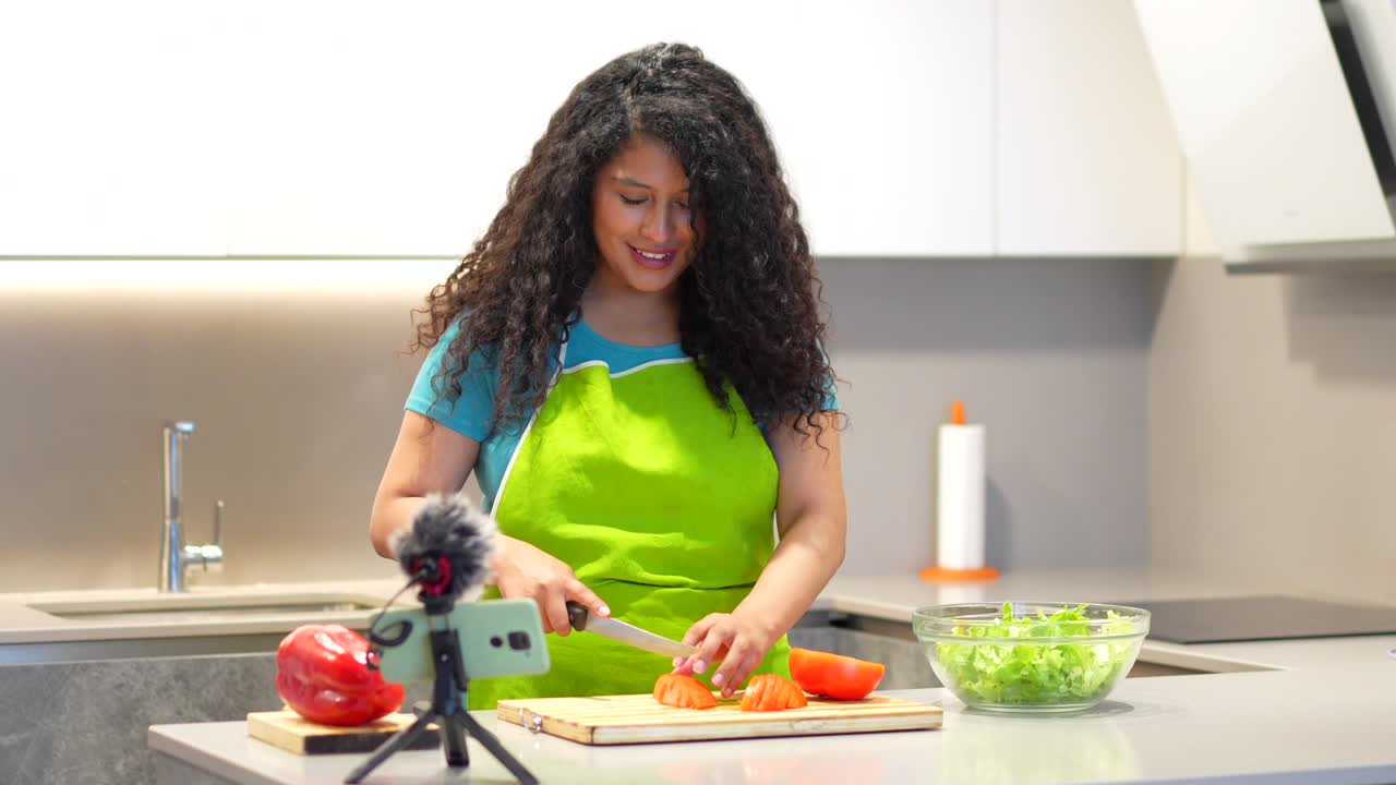 Woman Cooking Salad in Kitchen