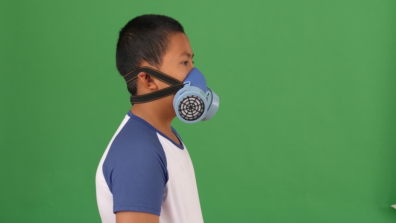 Young Boy Wearing Pollution Mask, Green Screen
