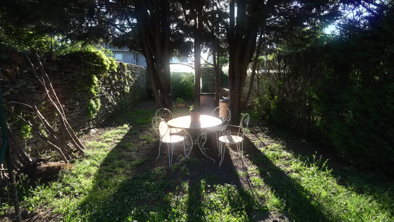 Garden patio set furniture table chairs early morning sunlight relaxation corner