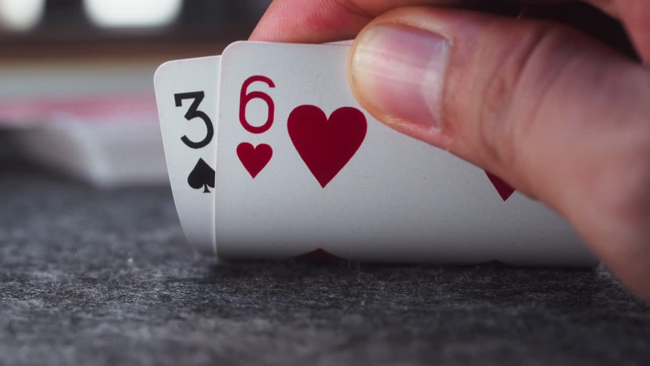 A close-up on a poker player's losing hand reveal, capturing the moment their luck runs dry