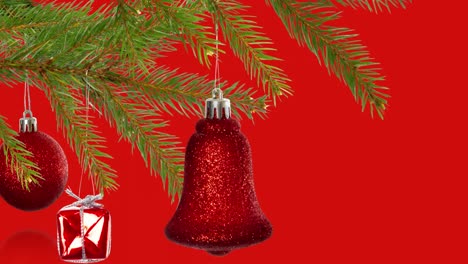 Animation-of-christmas-tree-decorations-over-red-background