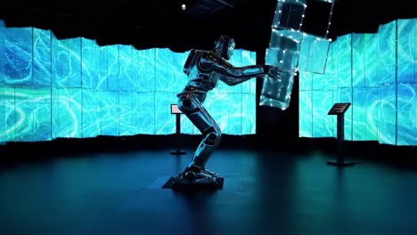 a striking showcase of advanced robotics, featuring a humanoid robot skillfully manipulating glowing cubes against a mesmerizing digital backdrop of swirling blue patterns
