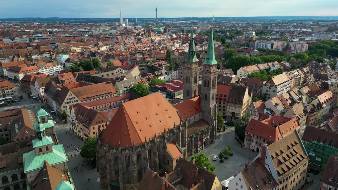 4K Aerial Drone Video of the Twin Spiers and Stained Glass Windows of the Beautiful St. Sebald Church in Downtown Nurnberg, Germany
