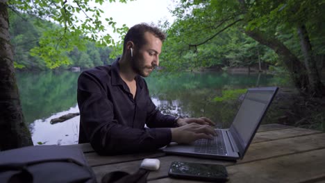 working with a laptop in nature.