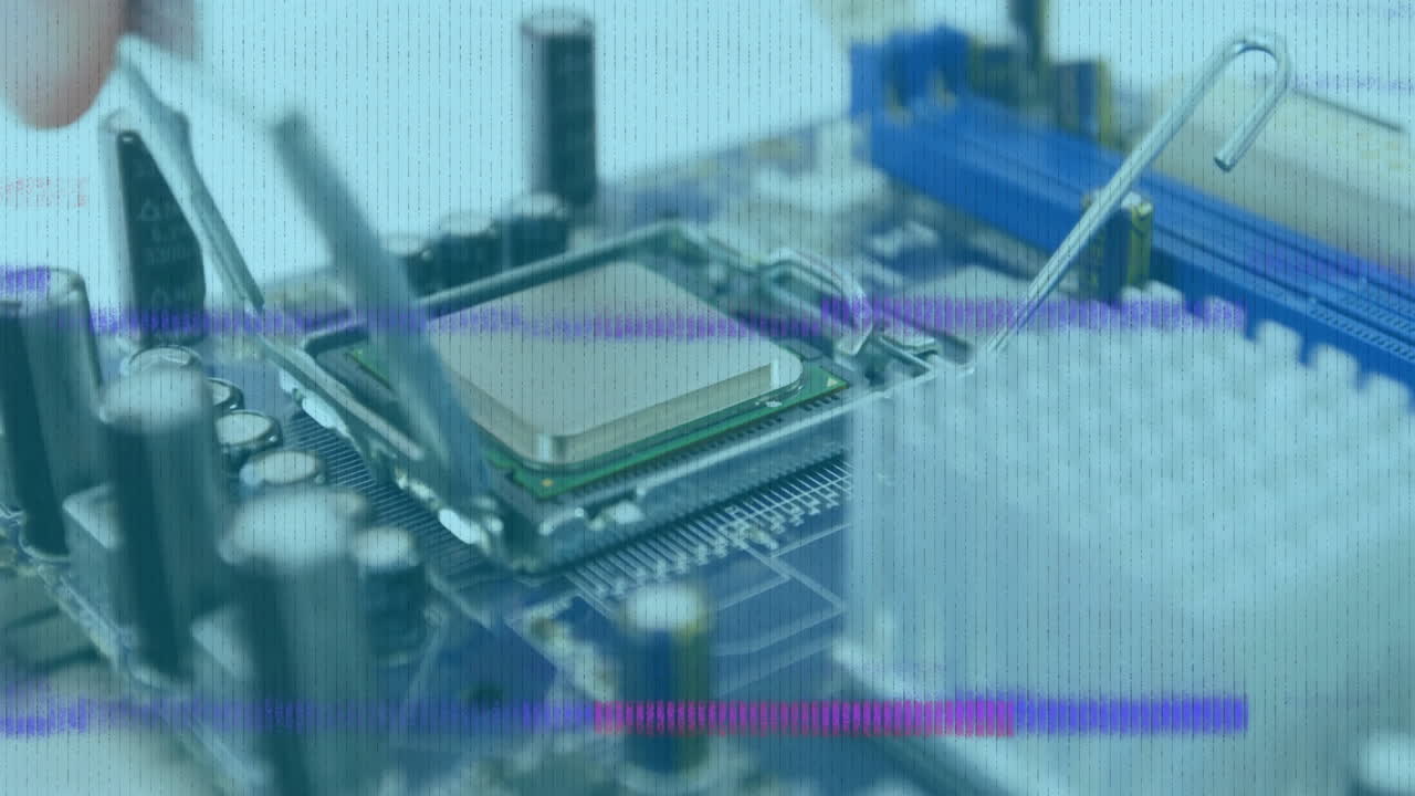 Placing processor into motherboard socket, hand working on computer circuit board