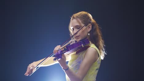 inspirational female musician playing the violin.