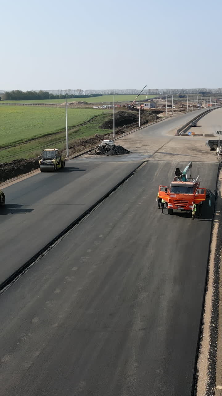 Road Construction with Heavy Equipment and Workers
