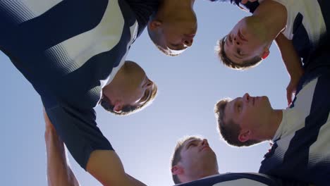 rugby players motivating before match