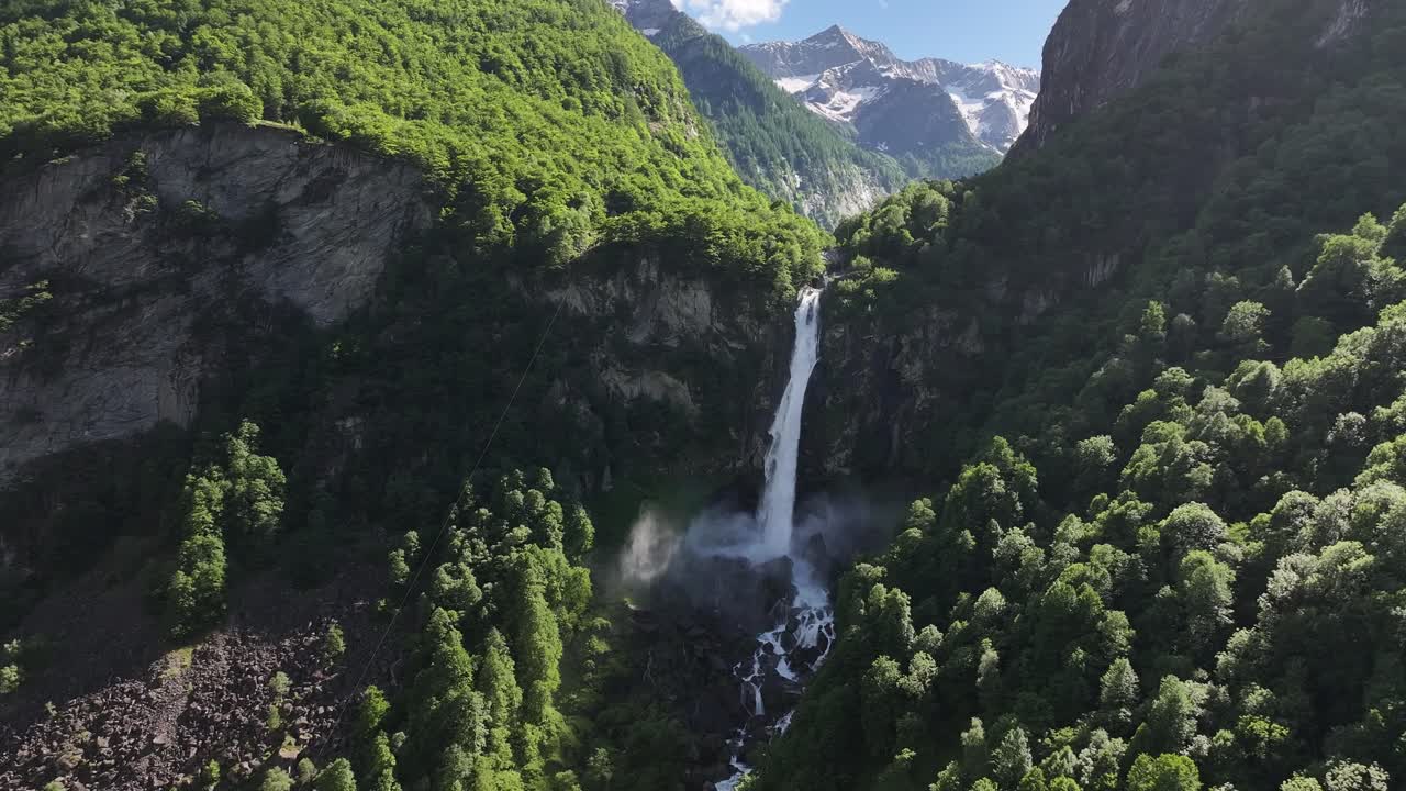 Aerial view of a waterfall tumbling down the cliffs in Maggiatal Vallemaggia, Tessin, Switzerland