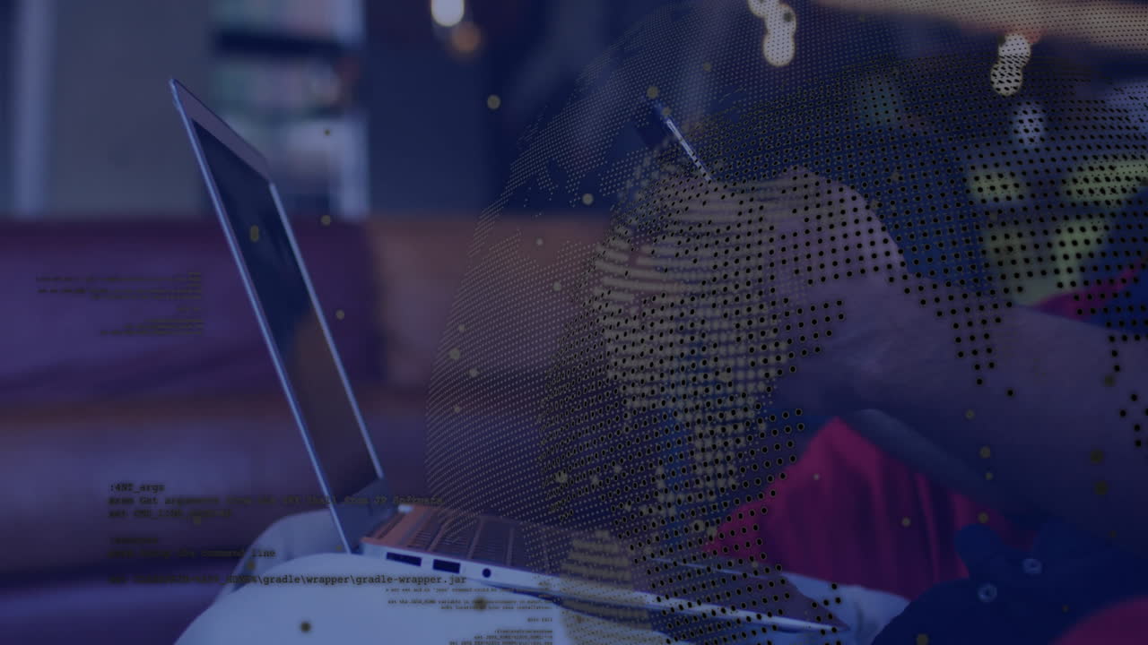 Laptop user in office with digital globe and data processing animation overlay